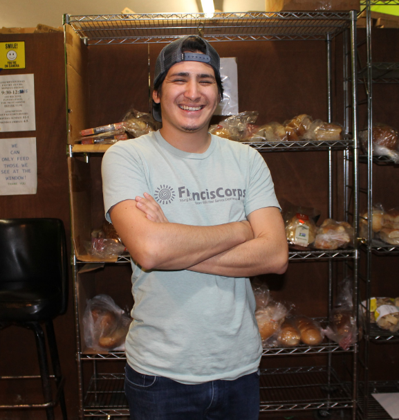 elias standing in front of bread