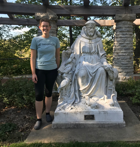 kate standing with st francis statue