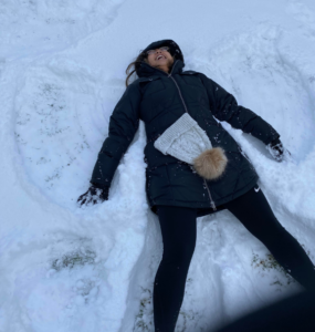 Phoebe making a snow angel