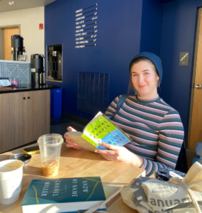 Laura reading at coffee shop