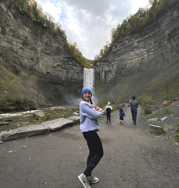 Miriam Jewell Blog 1 in front of a waterfall